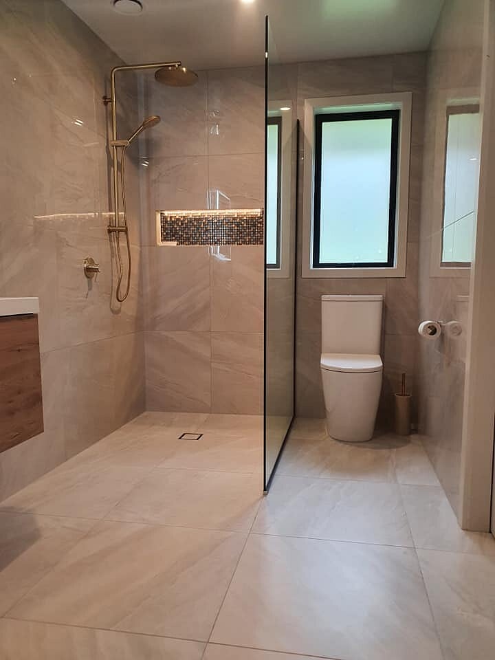 Tiled shower and toilet in a finished ensuite